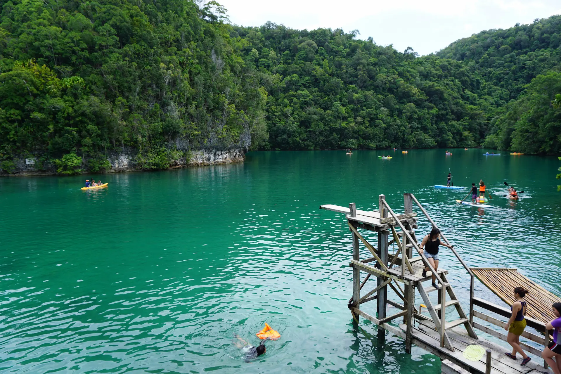 Sugba Lagoon with emerald-green water, limestone cliffs, and iconic diving board platform - Del Carmen, Siargao