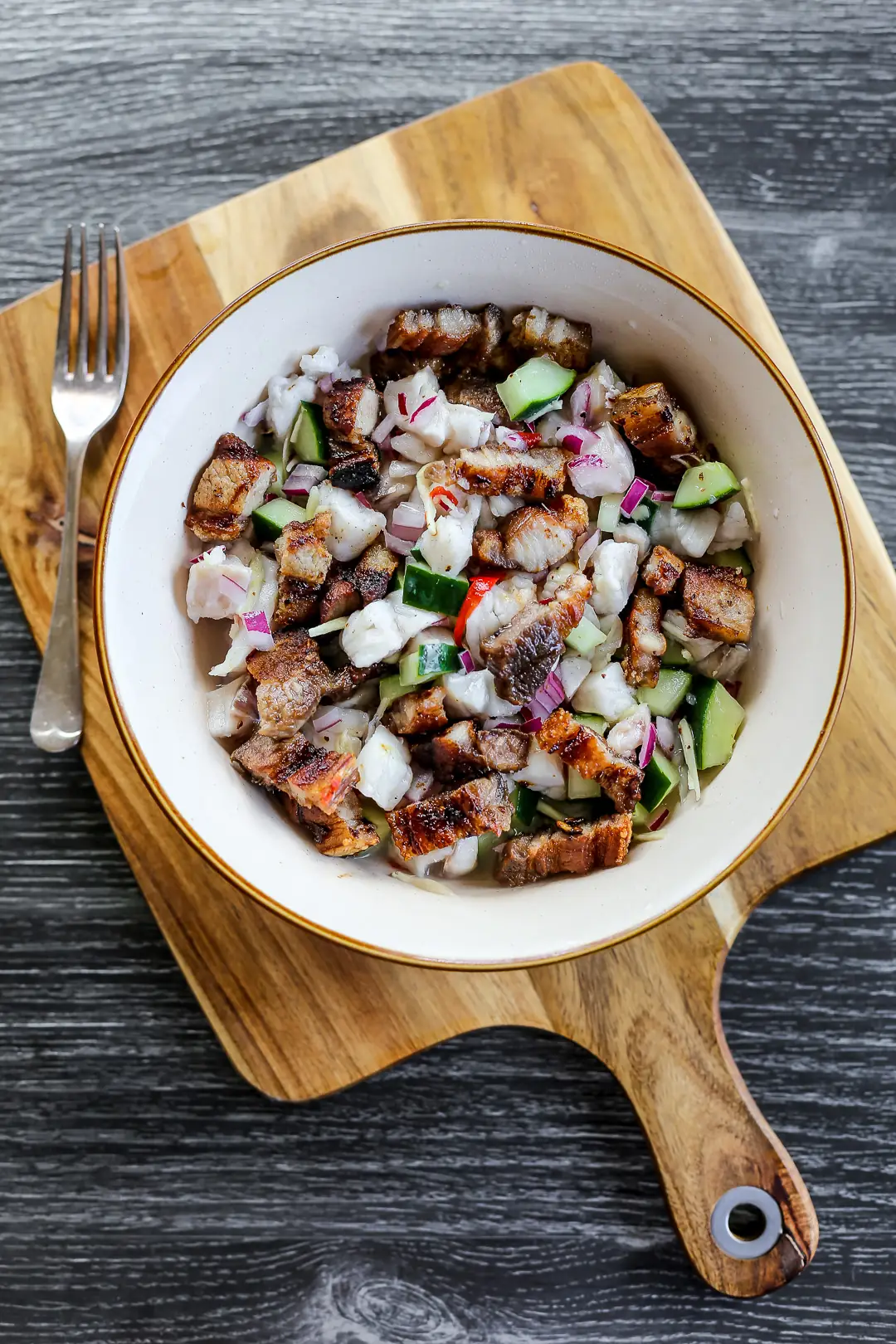 Sinuglaw — charcoal-grilled pork belly combined with kinilaw raw fish, a Filipino surf and turf